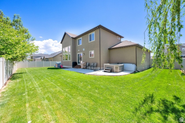 rear view of property featuring a patio area, stucco siding, and entry steps