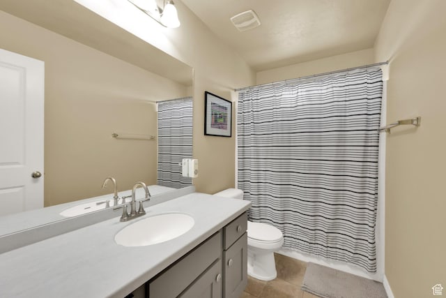 full bathroom with toilet, vanity, tile patterned floors, and a shower with shower curtain