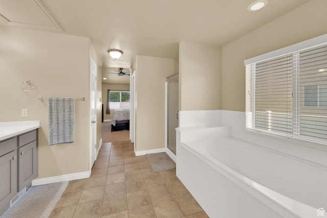 full bathroom with baseboards, ensuite bath, vanity, a bath, and recessed lighting