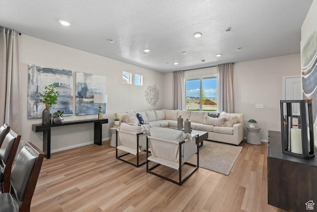 351 N Riverside Dr Unit 978, Saratoga Springs, UT 84045 - living room with light wood-type flooring, recessed lighting, baseboards, and a textured ceiling