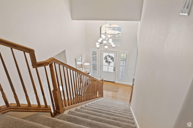 512 Glendon Way, Pleasant Grove, UT 84062 - foyer entrance with stairway, a chandelier, baseboards, and a high ceiling