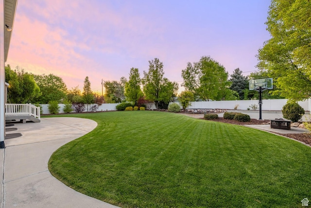 512 Glendon Way, Pleasant Grove, UT 84062 - yard at dusk featuring a patio and a fire pit