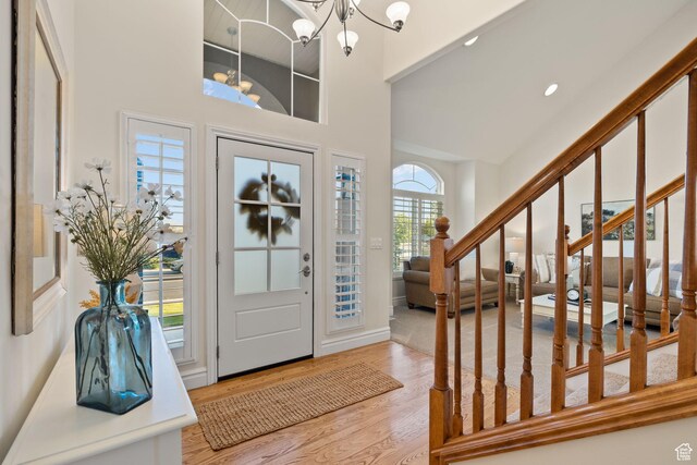 512 Glendon Way, Pleasant Grove, UT 84062 - entrance foyer featuring a chandelier, wood finished floors, a towering ceiling, stairway, and recessed lighting