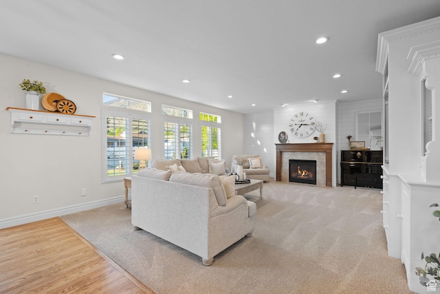 512 Glendon Way, Pleasant Grove, UT 84062 - living room with recessed lighting, a tile fireplace, light colored carpet, baseboards, and light wood-style flooring