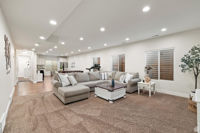 512 Glendon Way, Pleasant Grove, UT 84062 - living area featuring recessed lighting, baseboards, light wood finished floors, and light carpet