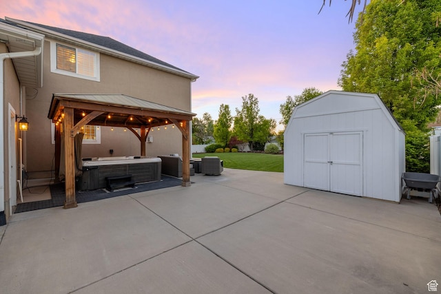 512 Glendon Way, Pleasant Grove, UT 84062 - view of patio with a hot tub, a gazebo, a storage shed, an outdoor structure, and central air condition unit