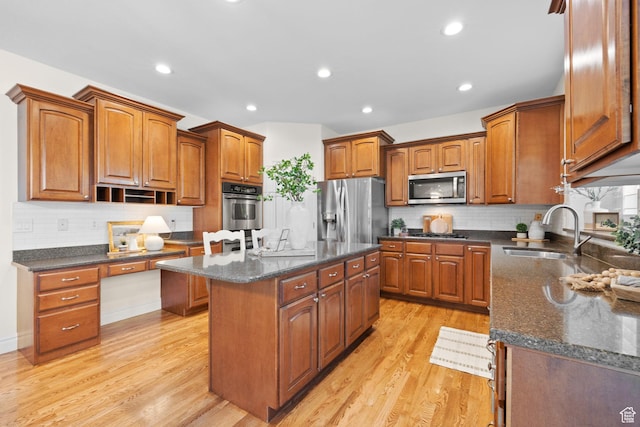 512 Glendon Way, Pleasant Grove, UT 84062 - kitchen with a sink, appliances with stainless steel finishes, a kitchen island, brown cabinetry, and recessed lighting
