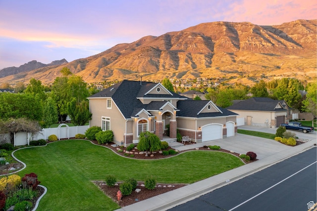 512 Glendon Way, Pleasant Grove, UT 84062 - view of front of house featuring a mountain view, a garage, driveway, and stucco siding