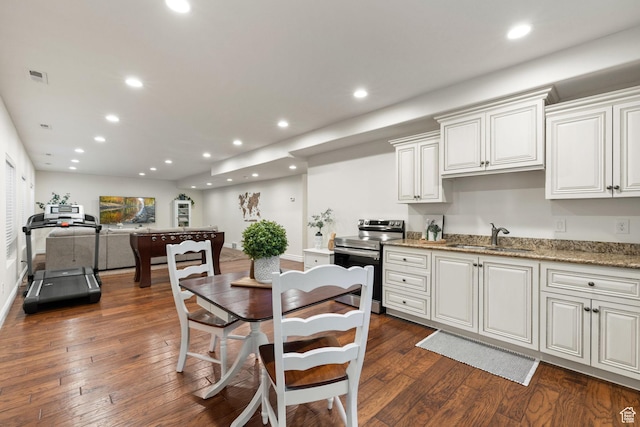 512 Glendon Way, Pleasant Grove, UT 84062 - kitchen featuring stainless steel range with electric stovetop, a sink, dark wood-type flooring, recessed lighting, and light stone countertops
