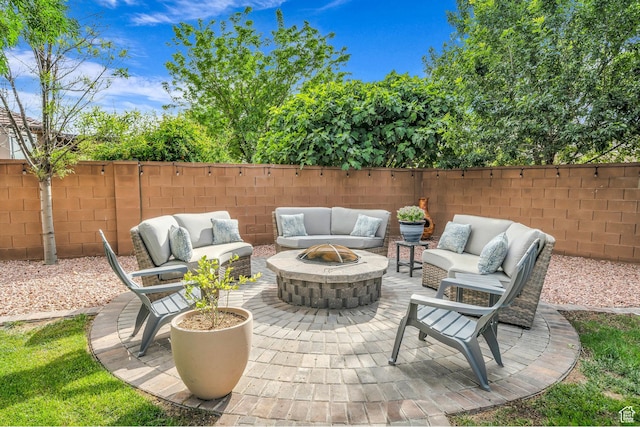 1492 S Carma St, Washington, UT 84780 - fenced backyard featuring an outdoor living space with a fire pit and a patio