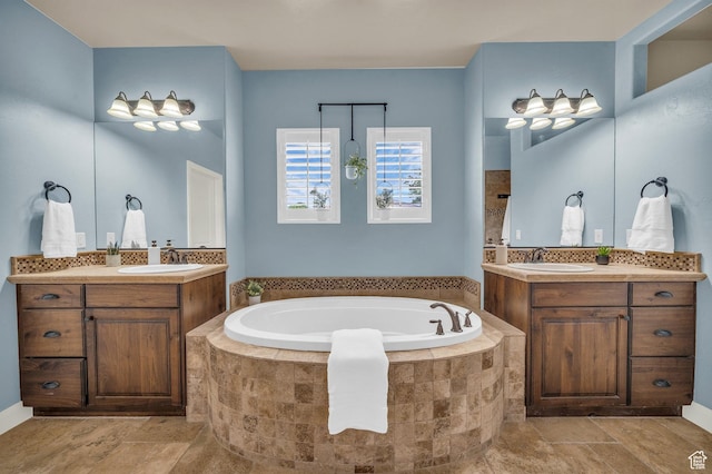 bathroom with a garden tub and two vanities