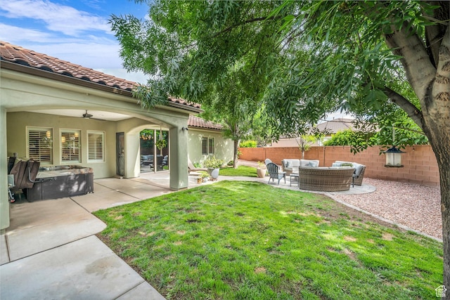 view of yard with outdoor lounge area, a patio area, and ceiling fan