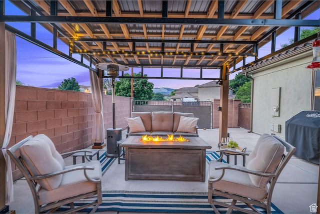 view of patio / terrace with an outdoor fire pit, a fenced backyard, and grilling area