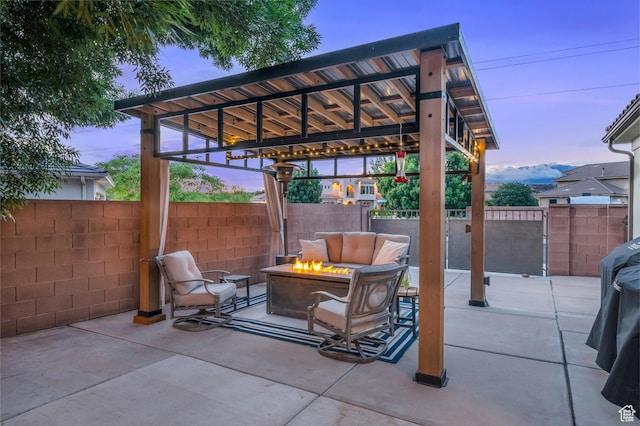 view of patio / terrace with an outdoor fire pit and fence