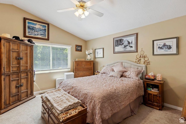 bedroom with light carpet, vaulted ceiling, baseboards, and ceiling fan