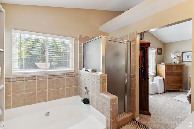 full bath with a garden tub, a shower stall, and lofted ceiling