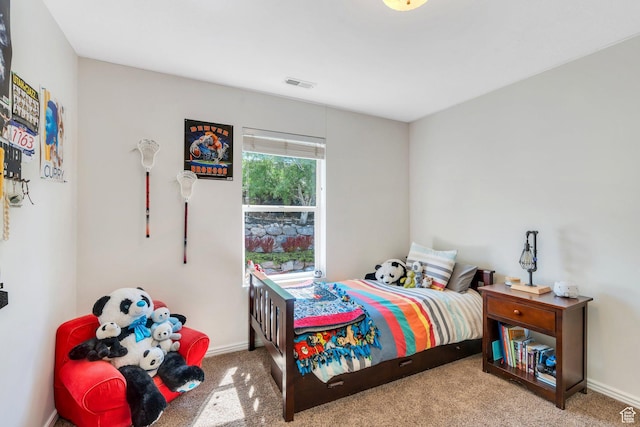 bedroom with carpet flooring and baseboards