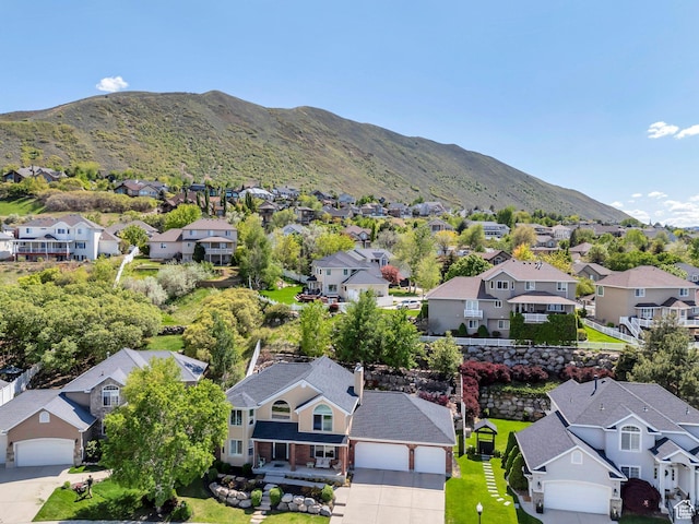 aerial view of residential area featuring a mountainous background