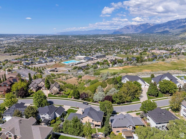 aerial view of residential area featuring mountains