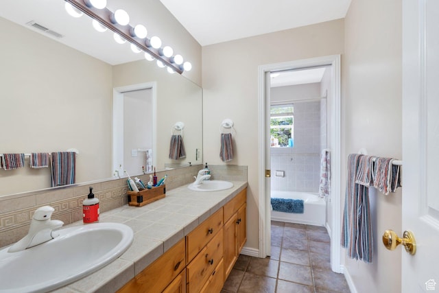 full bathroom with tile patterned flooring and double vanity