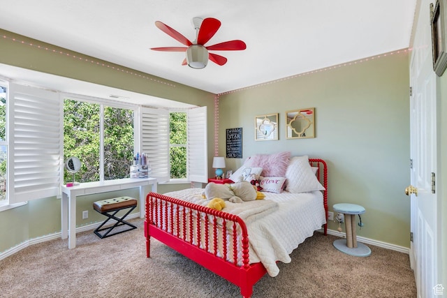 bedroom featuring carpet and baseboards