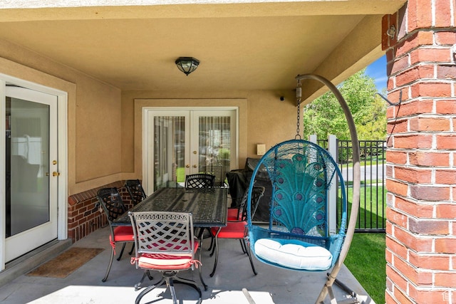 view of patio / terrace with outdoor dining area and french doors
