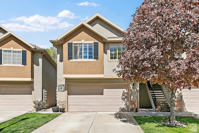 3123 E Canyon Glen Loop S, Spanish Fork, UT 84660 - view of front of property with stucco siding, driveway, a garage, and stairs
