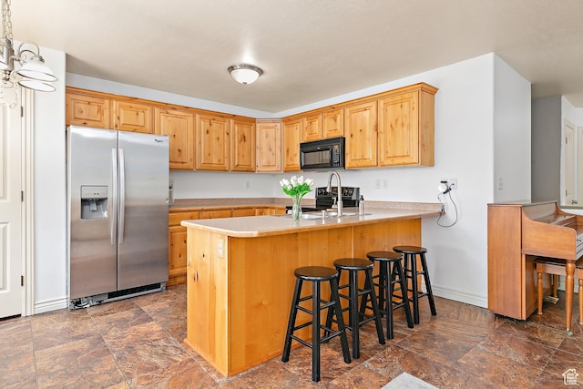 3123 E Canyon Glen Loop S, Spanish Fork, UT 84660 - kitchen featuring stainless steel fridge with ice dispenser, stone finish flooring, black microwave, and a peninsula