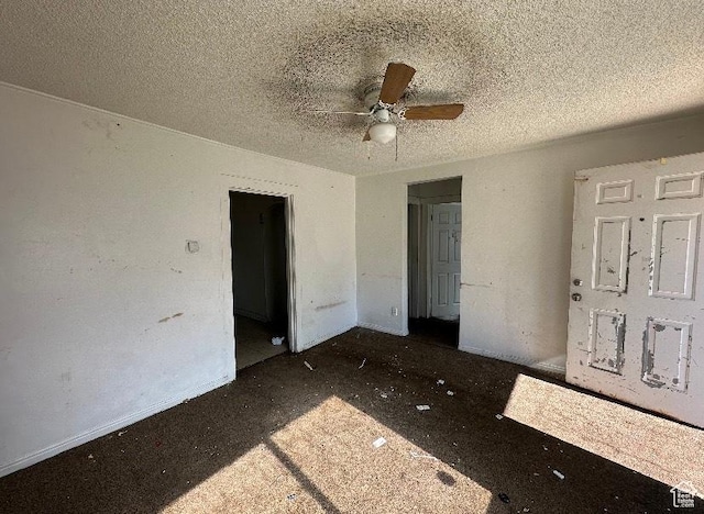 unfurnished bedroom with a textured ceiling and ceiling fan