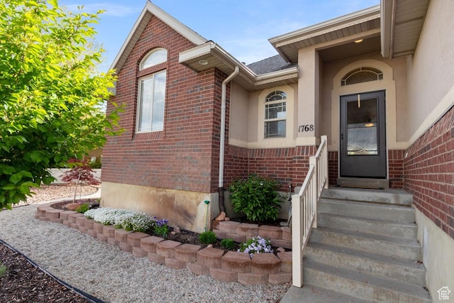 1768 N 200 W, North Ogden, UT 84414 - doorway to property with brick siding and stucco siding