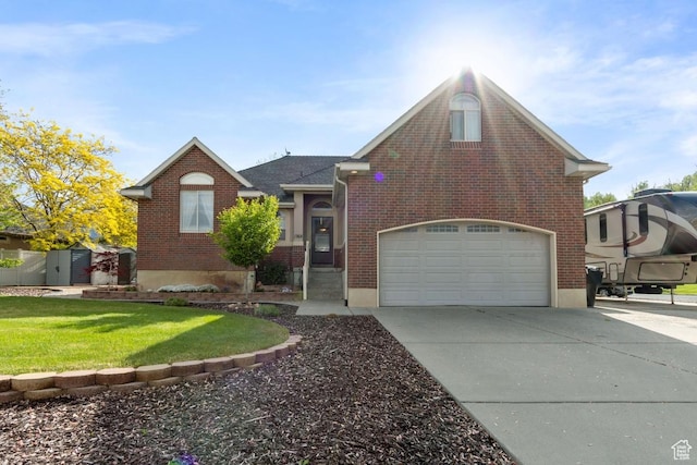 1768 N 200 W, North Ogden, UT 84414 - view of front of home with brick siding, driveway, and a front yard