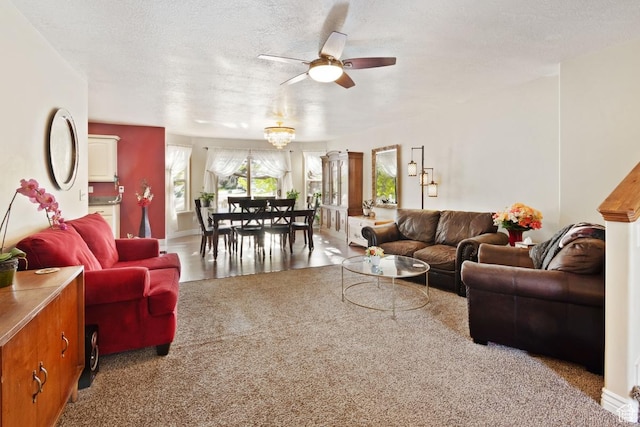 1768 N 200 W, North Ogden, UT 84414 - living area featuring a ceiling fan, a textured ceiling, carpet floors, baseboards, and a chandelier