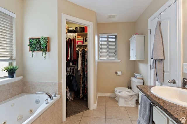 1768 N 200 W, North Ogden, UT 84414 - full bath featuring a whirlpool tub, tile patterned flooring, toilet, and a spacious closet