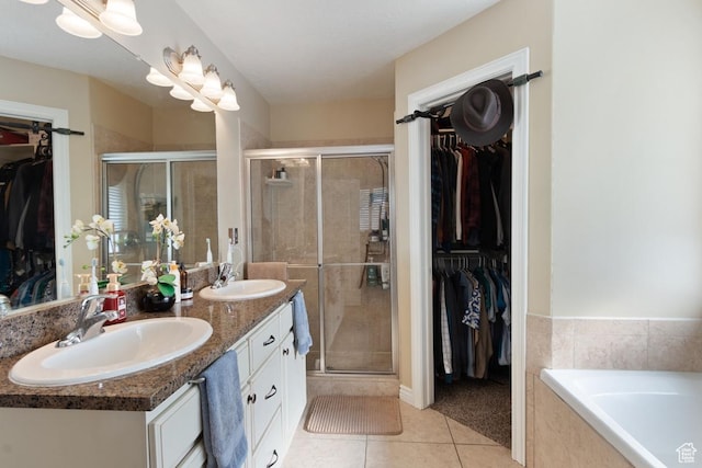 1768 N 200 W, North Ogden, UT 84414 - full bathroom with tile patterned floors, a stall shower, double vanity, a spacious closet, and tiled tub