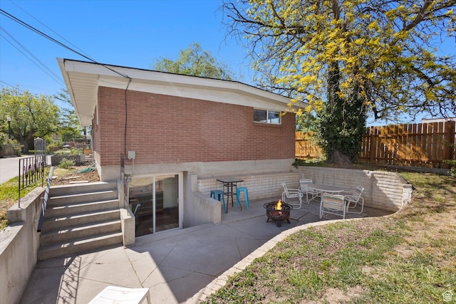 944 N 1400 W, Salt Lake City, UT 84116 - back of property featuring brick siding, a fire pit, fence, and a patio