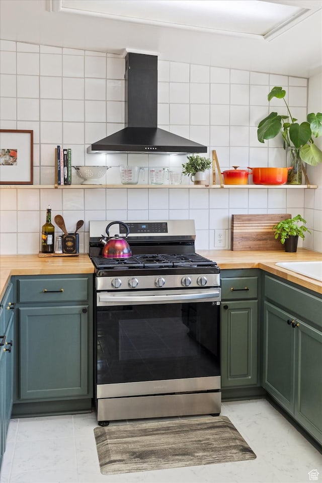 944 N 1400 W, Salt Lake City, UT 84116 - kitchen with stainless steel range with gas stovetop, wall chimney exhaust hood, green cabinets, wooden counters, and tasteful backsplash