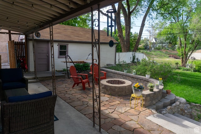 view of patio with an outdoor fire pit