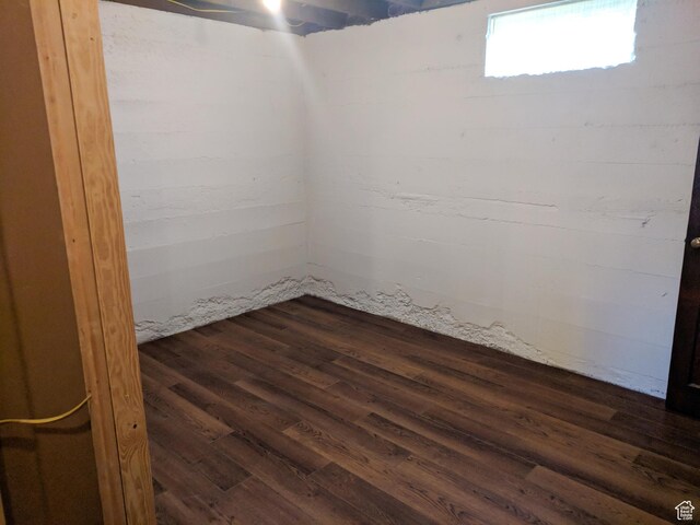 basement with dark wood-type flooring
