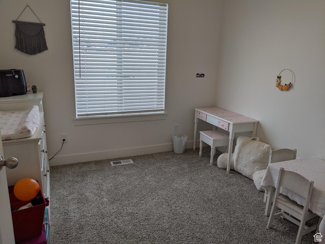 carpeted bedroom with baseboards