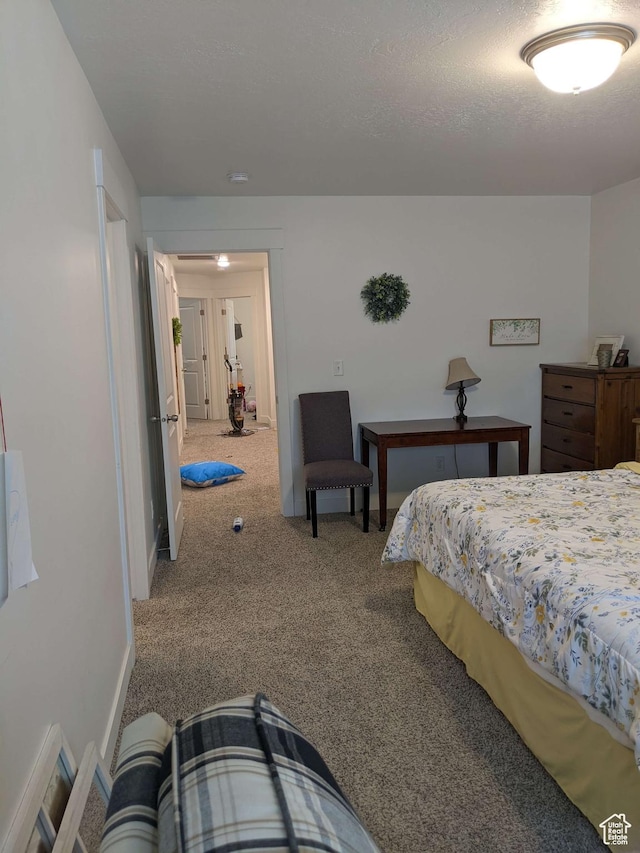 carpeted bedroom with baseboards