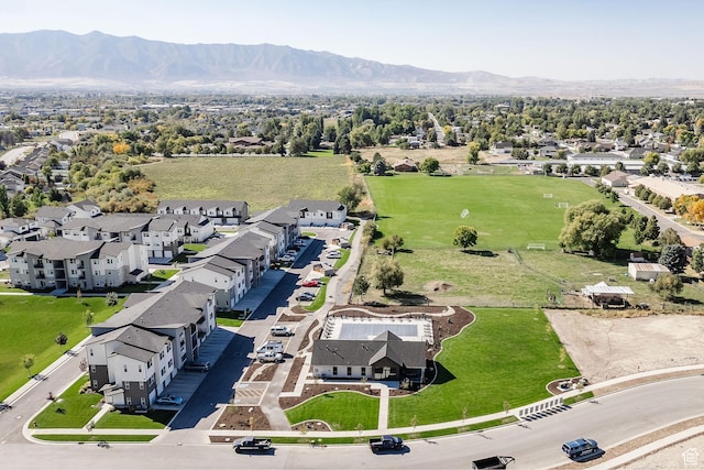 aerial view of residential area featuring a mountainous background