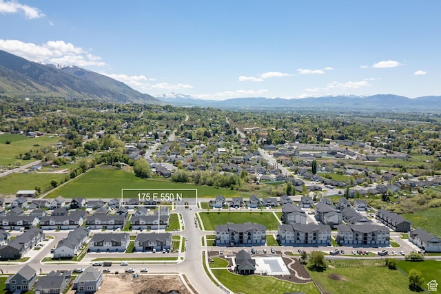 aerial perspective of suburban area featuring a mountain backdrop