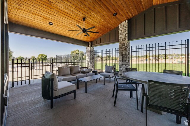 view of patio / terrace with an outdoor living space, outdoor dining area, ceiling fan, and fence