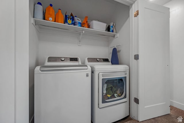 laundry room with washing machine and dryer and carpet floors