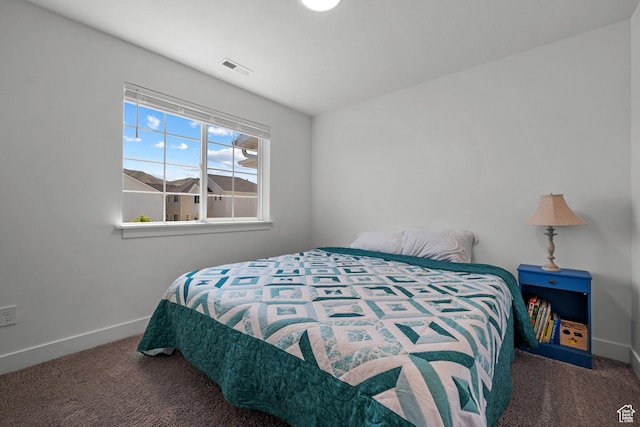 bedroom with carpet floors and baseboards