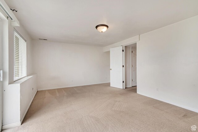 768 E 1740 S Unit 768, Orem, UT 84097 - spare room featuring light carpet and baseboards
