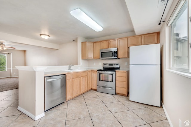 768 E 1740 S Unit 768, Orem, UT 84097 - kitchen featuring stainless steel appliances, light brown cabinets, a sink, and light countertops