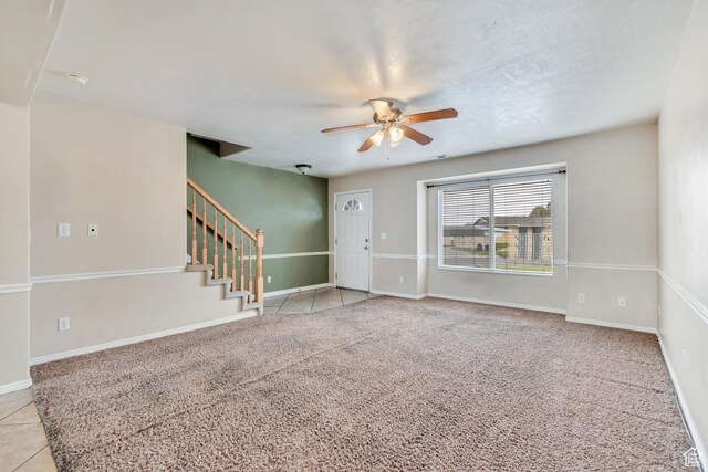768 E 1740 S Unit 768, Orem, UT 84097 - foyer with a ceiling fan, stairs, baseboards, light carpet, and light tile patterned floors