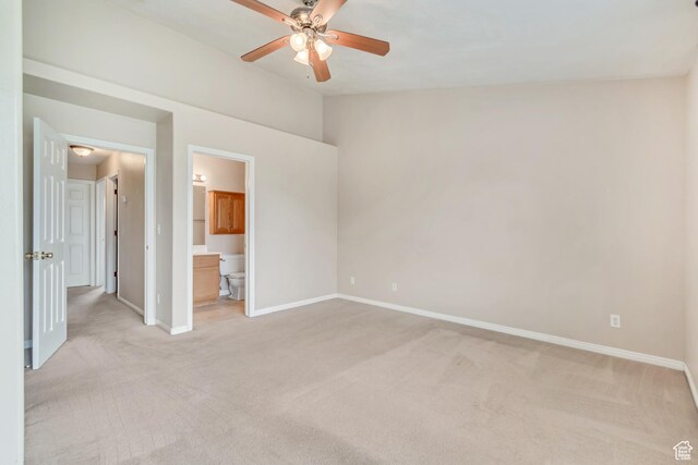 768 E 1740 S Unit 768, Orem, UT 84097 - unfurnished bedroom with light colored carpet, baseboards, vaulted ceiling, connected bathroom, and a ceiling fan