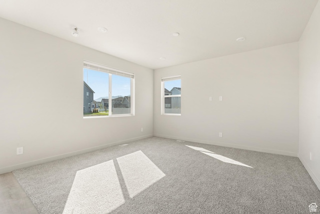 3523 N Browning St Unit 1233, Eagle Mountain, UT 84005 - unfurnished room with baseboards and light carpet